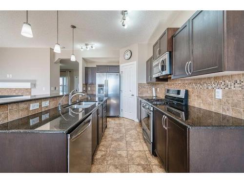 133 Panatella Parade Nw, Calgary, AB - Indoor Photo Showing Kitchen With Stainless Steel Kitchen With Double Sink With Upgraded Kitchen