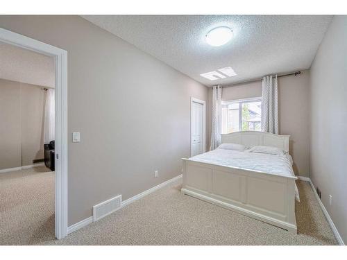 133 Panatella Parade Nw, Calgary, AB - Indoor Photo Showing Bedroom