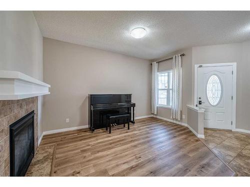 133 Panatella Parade Nw, Calgary, AB - Indoor With Fireplace