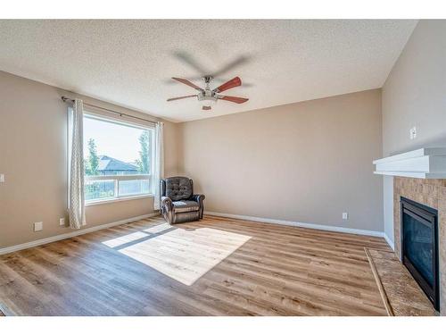 133 Panatella Parade Nw, Calgary, AB - Indoor With Fireplace