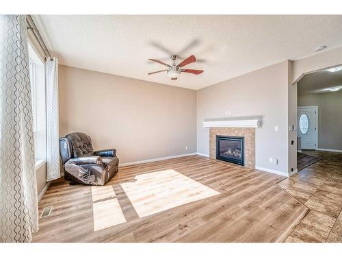 133 Panatella Parade Nw, Calgary, AB - Indoor Photo Showing Living Room With Fireplace