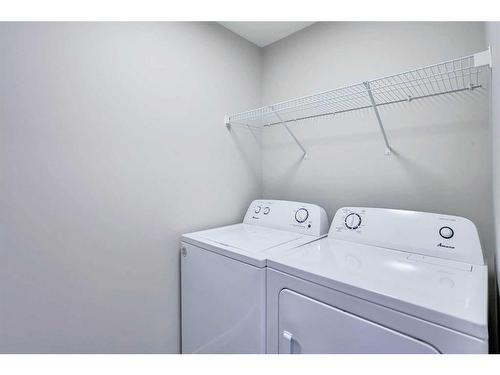 954 Cobblemore Common Sw, Airdrie, AB - Indoor Photo Showing Laundry Room