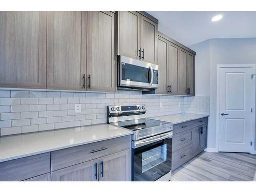 954 Cobblemore Common Sw, Airdrie, AB - Indoor Photo Showing Kitchen