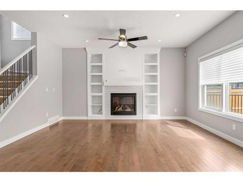 159 Sherview Grove Nw, Calgary, AB - Indoor Photo Showing Living Room With Fireplace