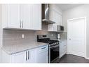 134 Howse Rise Ne, Calgary, AB  - Indoor Photo Showing Kitchen With Upgraded Kitchen 