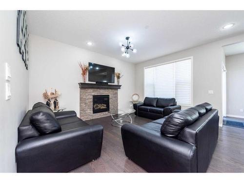 134 Howse Rise Ne, Calgary, AB - Indoor Photo Showing Living Room With Fireplace