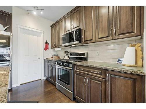 56 Jumping Pound Rise, Cochrane, AB - Indoor Photo Showing Kitchen