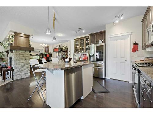 56 Jumping Pound Rise, Cochrane, AB - Indoor Photo Showing Kitchen With Upgraded Kitchen