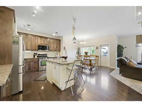 56 Jumping Pound Rise, Cochrane, AB - Indoor Photo Showing Kitchen With Upgraded Kitchen