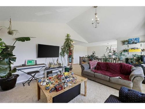 56 Jumping Pound Rise, Cochrane, AB - Indoor Photo Showing Living Room