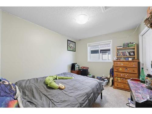 56 Jumping Pound Rise, Cochrane, AB - Indoor Photo Showing Bedroom