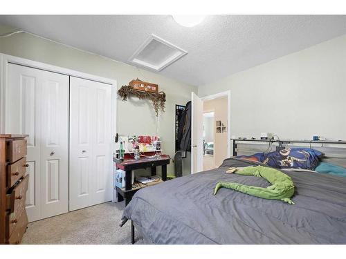 56 Jumping Pound Rise, Cochrane, AB - Indoor Photo Showing Bedroom