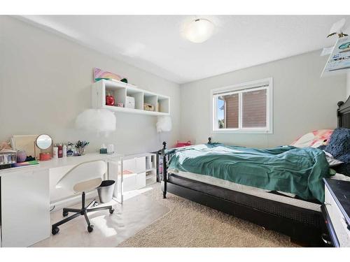 56 Jumping Pound Rise, Cochrane, AB - Indoor Photo Showing Bedroom