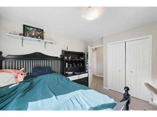 56 Jumping Pound Rise, Cochrane, AB - Indoor Photo Showing Bedroom