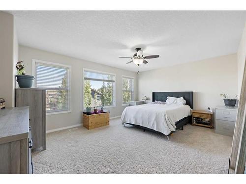 56 Jumping Pound Rise, Cochrane, AB - Indoor Photo Showing Bedroom