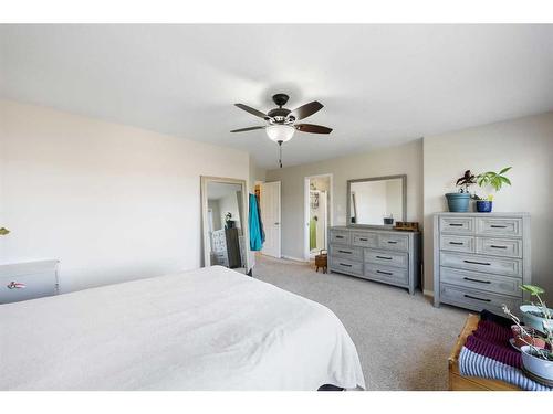 56 Jumping Pound Rise, Cochrane, AB - Indoor Photo Showing Bedroom