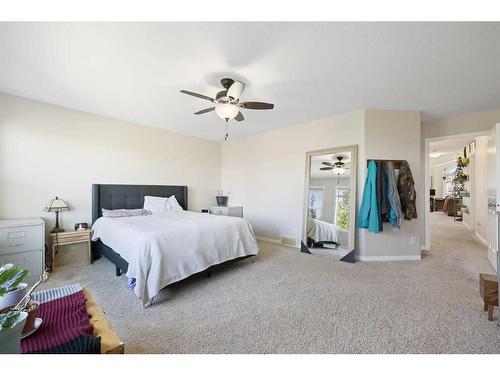 56 Jumping Pound Rise, Cochrane, AB - Indoor Photo Showing Bedroom