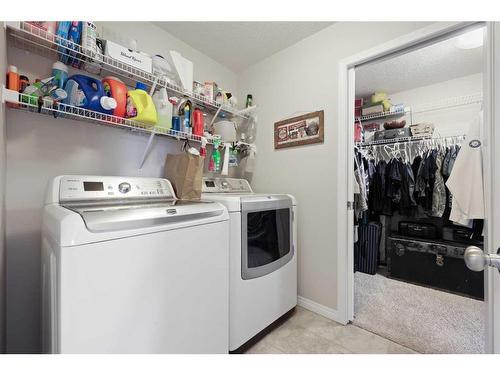 56 Jumping Pound Rise, Cochrane, AB - Indoor Photo Showing Laundry Room