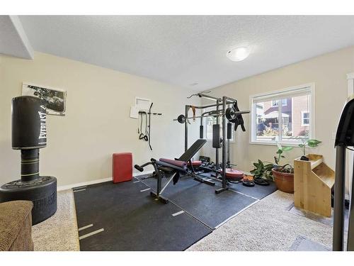 56 Jumping Pound Rise, Cochrane, AB - Indoor Photo Showing Gym Room