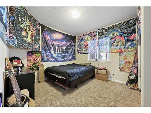 56 Jumping Pound Rise, Cochrane, AB - Indoor Photo Showing Bedroom