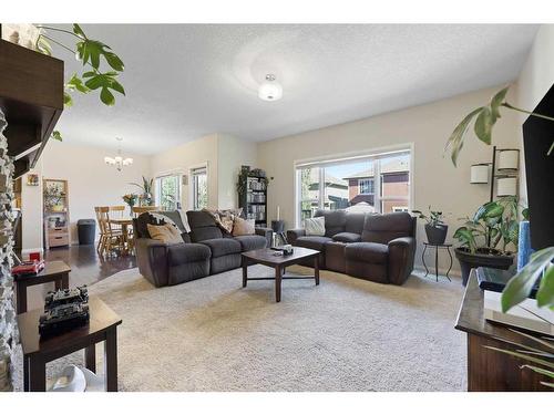 56 Jumping Pound Rise, Cochrane, AB - Indoor Photo Showing Living Room