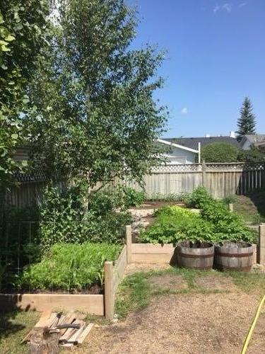 34 West Boothby Crescent, Cochrane, AB - Outdoor With Backyard