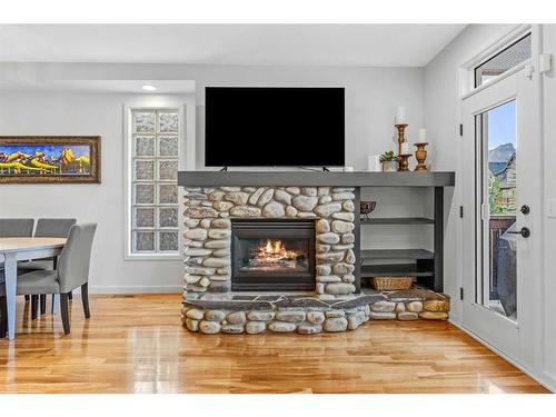 3-813 6Th Street, Canmore, AB - Indoor Photo Showing Living Room With Fireplace