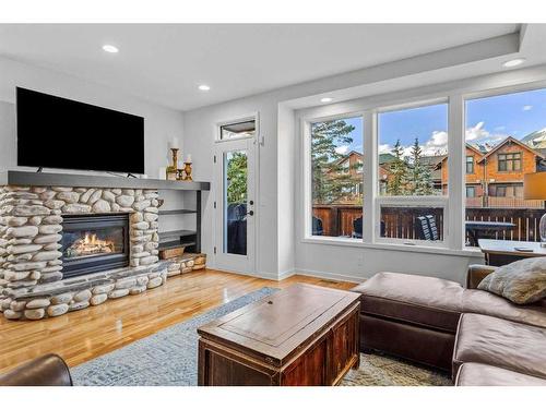 3-813 6Th Street, Canmore, AB - Indoor Photo Showing Living Room With Fireplace