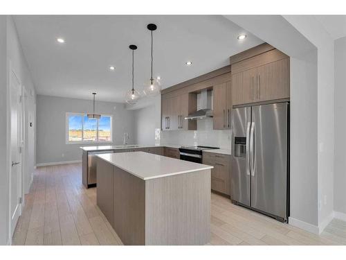 600 Dawson Drive, Chestermere, AB - Indoor Photo Showing Kitchen With Stainless Steel Kitchen With Upgraded Kitchen