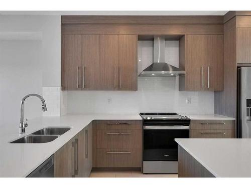 600 Dawson Drive, Chestermere, AB - Indoor Photo Showing Kitchen With Double Sink