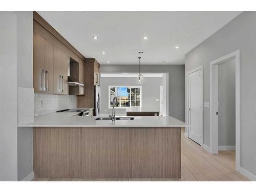 600 Dawson Drive, Chestermere, AB - Indoor Photo Showing Kitchen With Double Sink