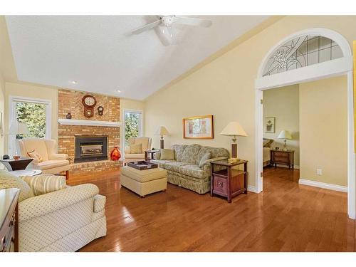 93 Shawnee Rise Sw, Calgary, AB - Indoor Photo Showing Living Room With Fireplace