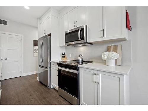 304-8355 19 Avenue Sw, Calgary, AB - Indoor Photo Showing Kitchen With Upgraded Kitchen