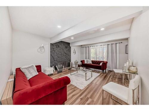 7 Berkshire Road Nw, Calgary, AB - Indoor Photo Showing Living Room With Fireplace