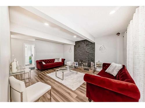 7 Berkshire Road Nw, Calgary, AB - Indoor Photo Showing Living Room With Fireplace