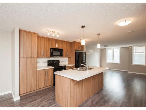 545 Mckenzie Towne Close Se, Calgary, AB - Indoor Photo Showing Kitchen With Double Sink