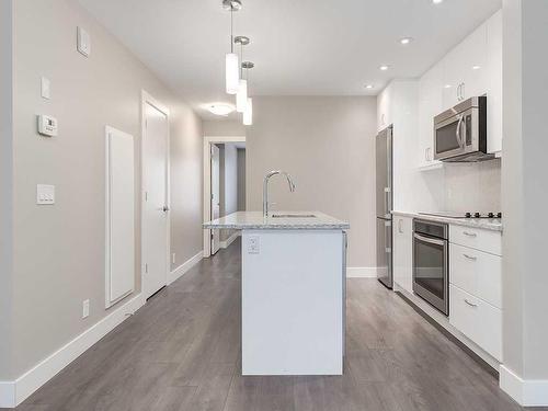 104-20 Brentwood Common Nw, Calgary, AB - Indoor Photo Showing Kitchen With Upgraded Kitchen