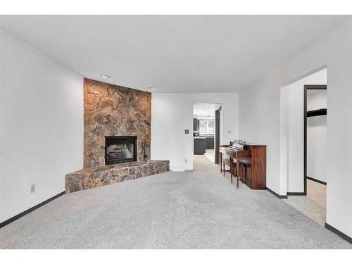 2409 146 Avenue Se, Calgary, AB - Indoor Photo Showing Living Room With Fireplace