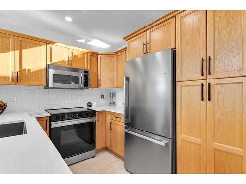 301-390 Marina Drive, Chestermere, AB - Indoor Photo Showing Kitchen With Stainless Steel Kitchen