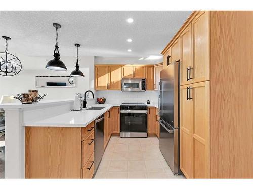 301-390 Marina Drive, Chestermere, AB - Indoor Photo Showing Kitchen With Stainless Steel Kitchen