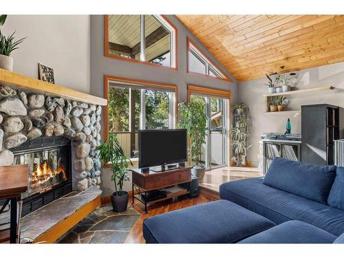 50 Ridge Road, Canmore, AB - Indoor Photo Showing Living Room With Fireplace