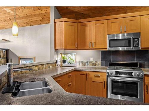 50 Ridge Road, Canmore, AB - Indoor Photo Showing Kitchen With Double Sink