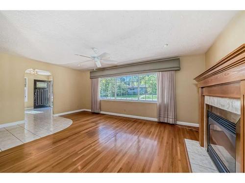 8016 7 Street Sw, Calgary, AB - Indoor Photo Showing Living Room With Fireplace