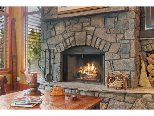 163 Cairns Landing, Canmore, AB - Indoor Photo Showing Living Room With Fireplace