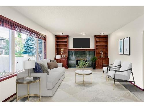 140 Evergreen Close Sw, Calgary, AB - Indoor Photo Showing Living Room With Fireplace