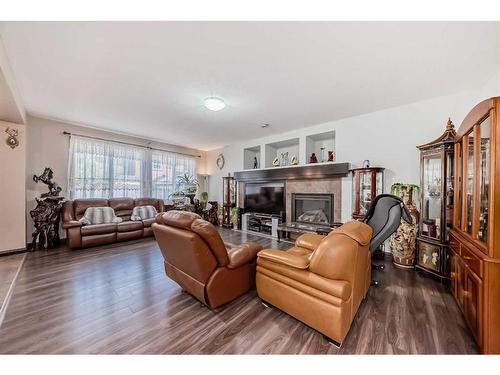 116 Evanspark Circle Nw, Calgary, AB - Indoor Photo Showing Living Room With Fireplace