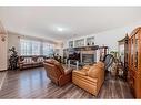 116 Evanspark Circle Nw, Calgary, AB  - Indoor Photo Showing Living Room With Fireplace 