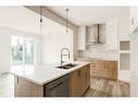 203 Silver Spruce Grove Sw, Calgary, AB  - Indoor Photo Showing Kitchen With Double Sink With Upgraded Kitchen 