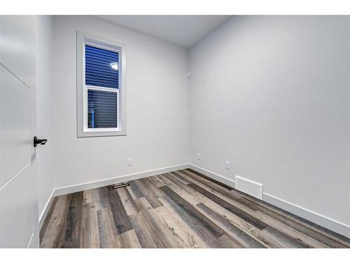 59 Sunrise Heath, Cochrane, AB - Indoor Photo Showing Other Room