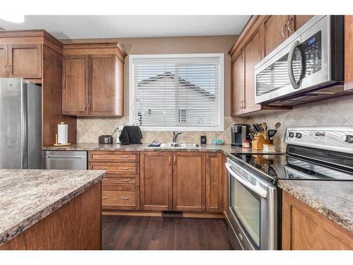 1118 New Brighton Park Se, Calgary, AB - Indoor Photo Showing Kitchen With Stainless Steel Kitchen With Double Sink